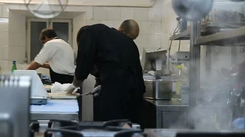  Cooking fish in a restaurant kitchen Video stock 12032806