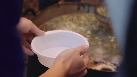 Cooking fish soup on a campfire Video stock 120495182