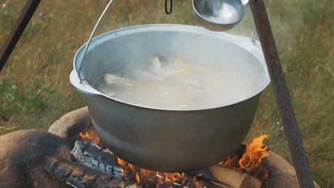 Cooking fish soup on the fire Stock Footage 93139509
