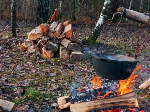 Cooking Fish Soup On The Fire Stock Photos