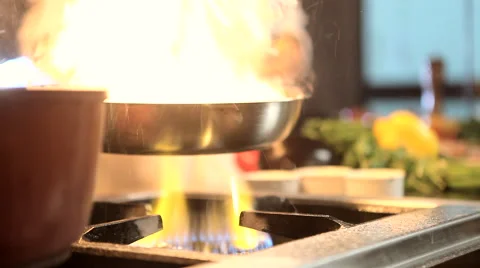Cooking with Flames in the Kitchen Stock Footage 49698268