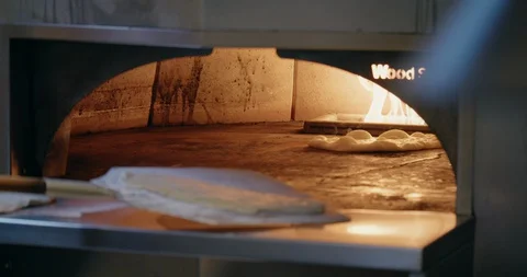 Cooking Flatbread in Fire Oven Video stock 129847894
