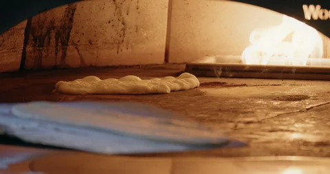 Cooking Flatbread in Fire Oven Video stock 129848042
