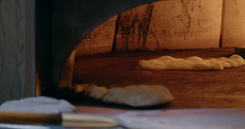 Cooking Flatbread in Fire Oven Video stock 129848643