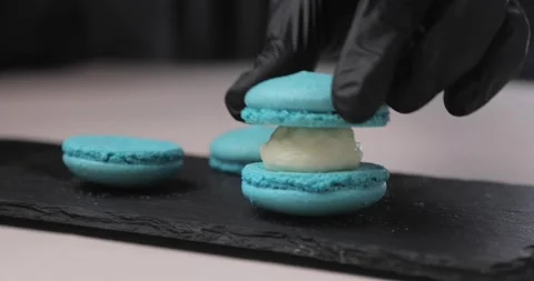 Cooking, food and baking concept - chef with pastry bag squeezes cream filling Stock Footage 165872753