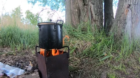 Cooking in the forest. Video stock 131369439