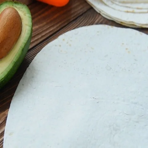Cooking freezer breakfast burritos on corn tortilla Stock Footage 69512144