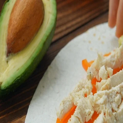 Cooking freezer breakfast burritos on corn tortilla Stock Footage 69512388