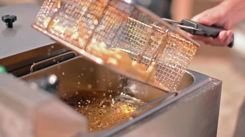 Cooking french fresh fries, boiling in oil at the Outdoor Stock Footage 59086249