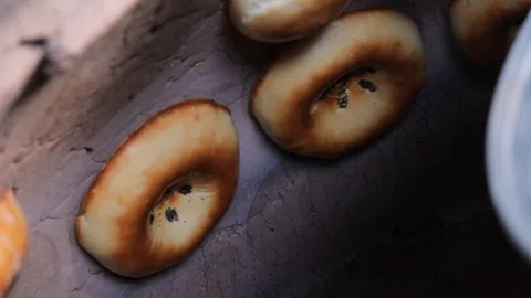 Cooking fresh bread in a traditional oven Stock Footage 103624418
