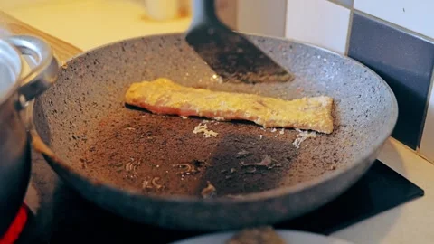Cooking Fresh Cod Fillet on Pan Showing Clean Healthy Home Lifestyle Choice Stock Footage 325947996