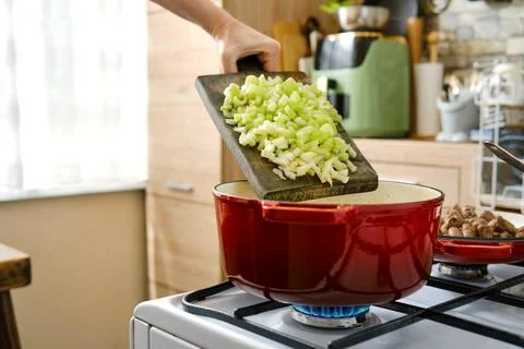 Cooking with fresh ingredients in a kitchen while preparing a meal in the a.. Stock Photos