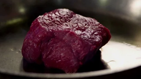 Cooking fresh meat in slow motion Stock Footage 73605396