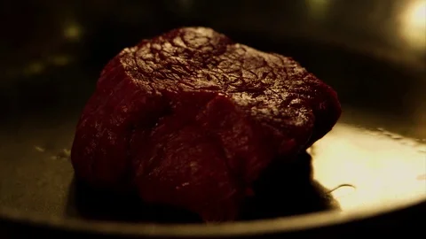 Cooking fresh meat in slow motion Stock Footage 73605402
