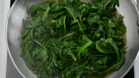 Cooking fresh spinach Stock Footage 148225563