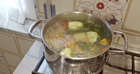 Cooking fresh vegetables into a boiling pot- 4k extreme slow motion - rotate Stock Footage 151643362