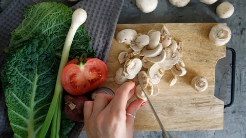 Cooking fresh vegetables. Cuts on a cutting wooden board ingredients. Stock Footage 110806817