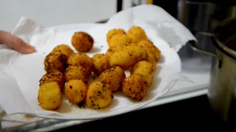 Cooking fried cheese balls - in a cauldron Stock Footage 114610846