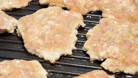 Cooking fried cutlets on the grill. Turkey cutlets Stock Footage 119409097