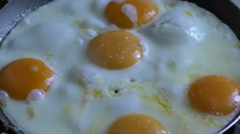 Cooking fried eggs Stock Footage 52003577