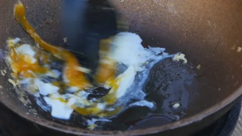 Cooking fried eggs on a frying pan Stock Footage 77568257