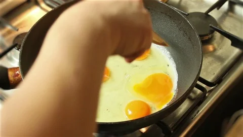 Cooking Fried Eggs at home. Stock Footage 81682442