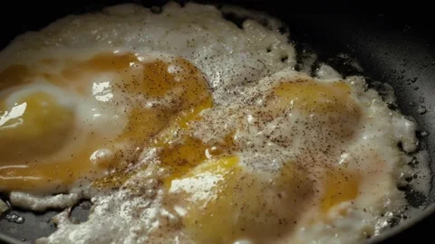 Cooking Fried eggs. Process of Preparation of Two Fried Egg. Full Cycle of Stock Footage 113453318