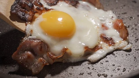 Cooking Fried eggs. Process of Preparation of Three Fried Egg. Stock Footage 124404541