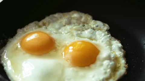 Cooking fried eggs timelapse Stock Footage