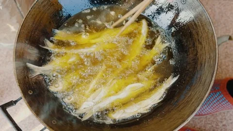 Cooking fried fish Stock Footage 83506613