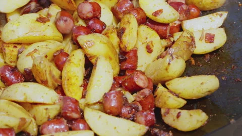 Cooking fried potatoes in a large frying pan Video stock 245803280