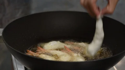Cooking fried prawn balls in hot pan Stock Footage 97063641