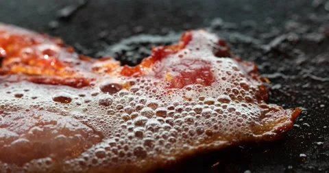 Cooking frying bacon. Stock Footage 145917701