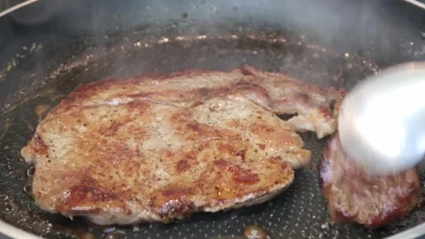 Cooking: Frying steak Stock Footage 278348348