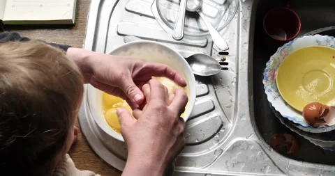 Cooking Fun: Top-Down View of Adult and Toddler Hands Making a Pie 動画素材 241276249