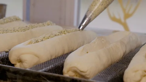 Cooking garlic bread in bakery Stock Footage 108634682