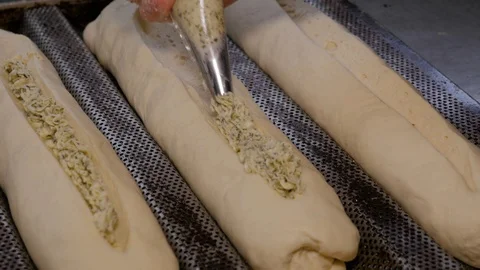 Cooking garlic bread in bakery Stock Footage 109473132