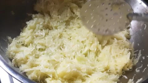 Cooking Grated Raw Mango in Ghee for Traditional Mango Preserve Video stock 335633746