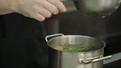 Cooking the green beans in a large volume of water in a saucepan Stock Footage 87751202