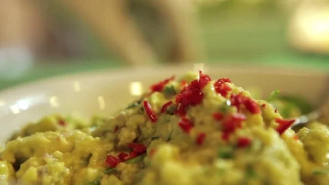 Cooking guaca mole with chili Stock Footage 75275961