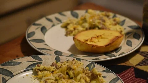 Cooking handheld adding breakfast potatoes eggs bagel Stock Footage 93969887