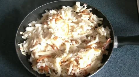 Cooking Hash Browns in Pan 스톡 동영상 12576570