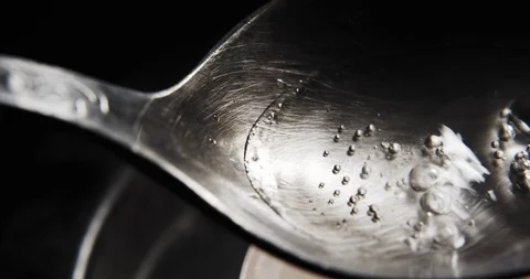 Cooking Heroin on spoon Vídeos de archivo 91067931