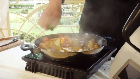 Cooking with high fire Stock Footage 107532383