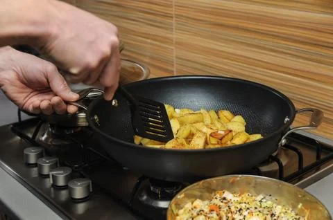 Cooking at home kitchen. Stock Photos