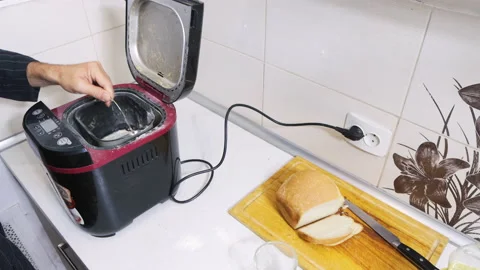 Cooking homemade bread in a bread machine, the economic crisis and sanctions, th Stock Footage 212075593