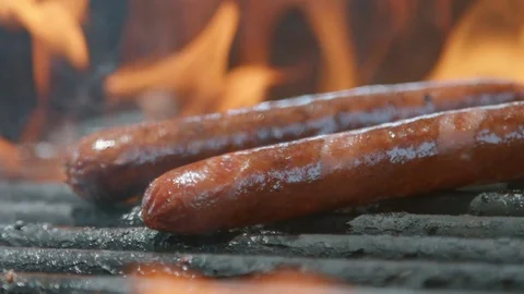 Cooking Hot Dogs on a Grill Stock Footage