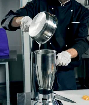 Cooking ingredients in pan in the kitchen Stock Photos