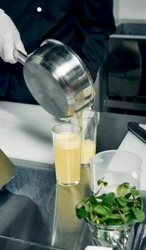 Cooking ingredients in pan in the kitchen Stock Photos