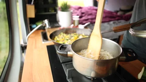 Cooking inside a caravan Stock Footage 135381347